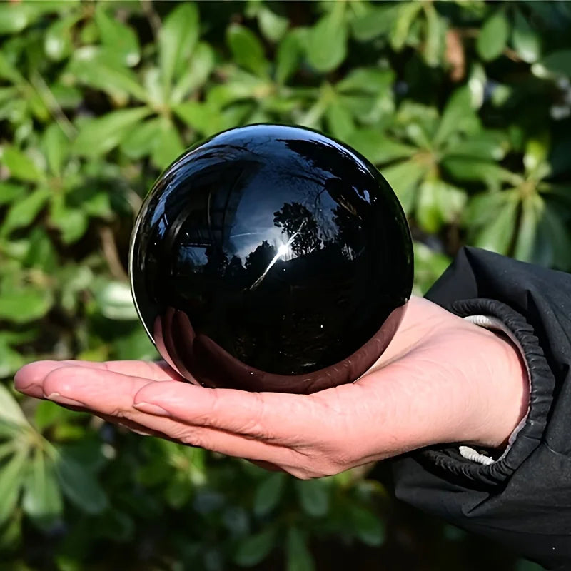 Boule en obsidienne noire naturelle polie – de 2 à 13 cm tenue dans les mains, d'une beauté impressionnante, parfaite pour les objets spirituels et la décoration.
